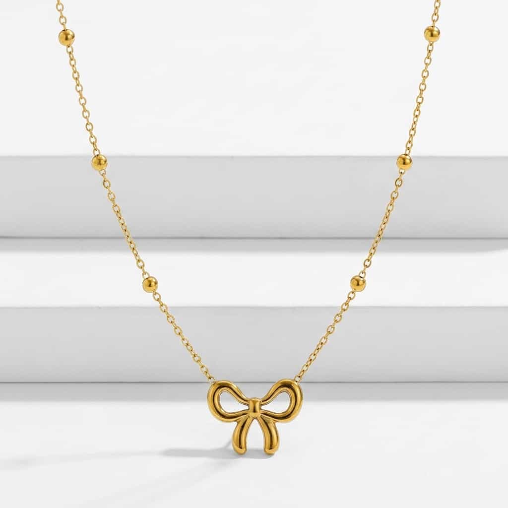 Golden bow pendant necklace